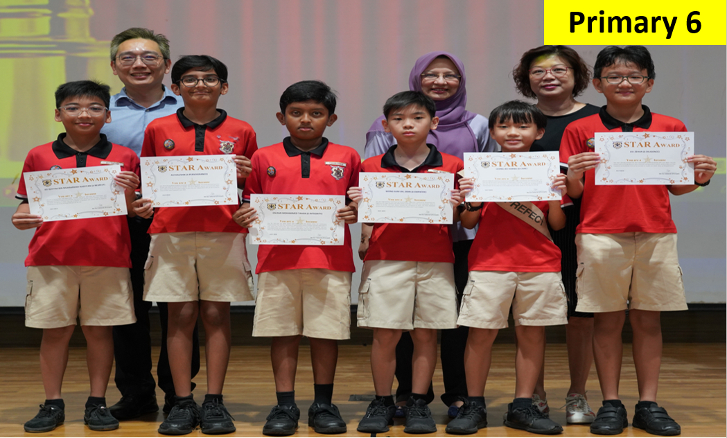 Six Primary 6 students in red uniforms hold Star Award certificates, flanked by two adult teachers on a stage.